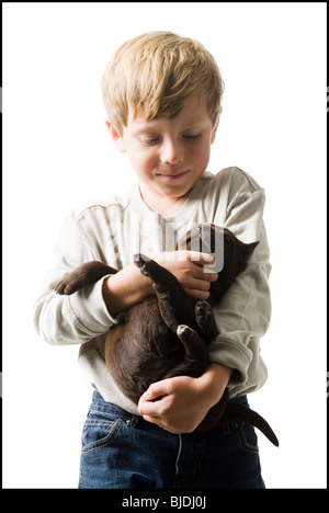 child with puppy Stock Photo