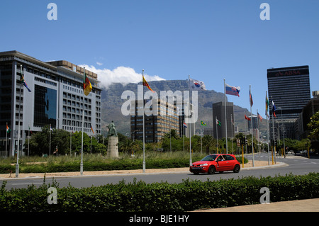 Table Mountain with cloud gathering overlooks the office premises along Adderley Street in Cape Town's city centre. South Africa Stock Photo