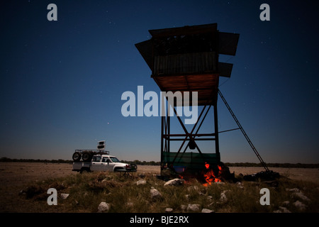 Night film crew with IR lighting wagon on location on location relaxing in the early evening before work starts Stock Photo