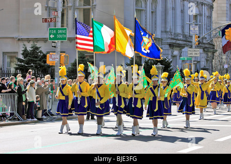 All girl marching band marches up 5th Ave. at the New York City St. Patrick's Day parade Stock Photo