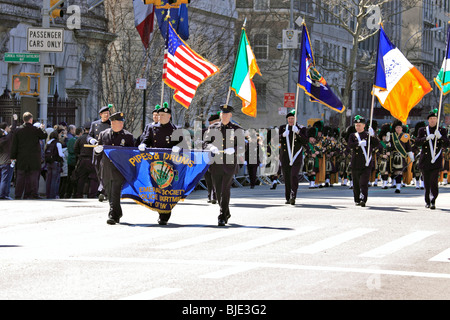 New York City Police Department Emerald Society Pipes and Drums marching band on 5th Ave in Manhattan St. Patrick's Day parade Stock Photo