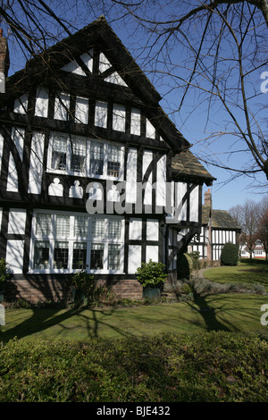 Village of Port Sunlight, England. The black and white timbered houses on Port Sunlight’s Queen Mary’s Drive. Stock Photo