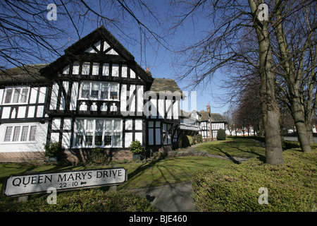 Village of Port Sunlight, England. The black and white timbered houses on Port Sunlight’s Queen Mary’s Drive. Stock Photo