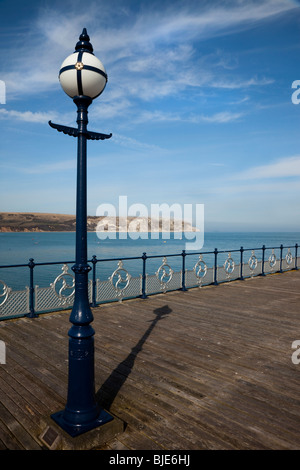 Swanage Pier shadow pointing to Old Harry Rocks Stock Photo