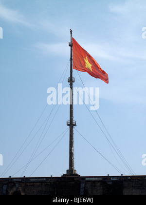 The Vietnam flag on a pole outside the Imperial Palace in Hue, Vietnam Stock Photo