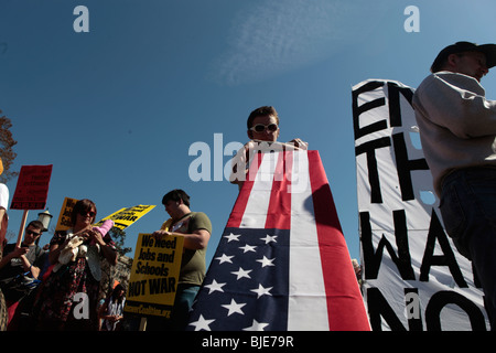Protester with flag draped coffin symbol. 'End the War sign' Anti-war protest. March On Washington. March 20, 2010 Stock Photo