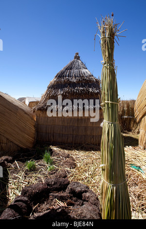 On floating islands, house of Uros Indians, Puno, Altiplano, Lake Titicaca, Desaguadero River, Peru, South America Stock Photo