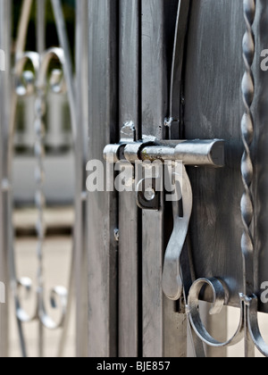 Steel sliding bolt lock on a security  gate. Stock Photo