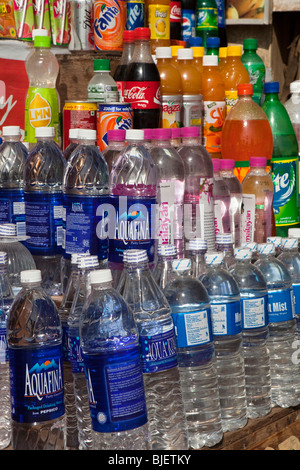 India, Kerala, Varkala, tourist shop selling bottled drinking water and soft drinks in plastic bottles Stock Photo