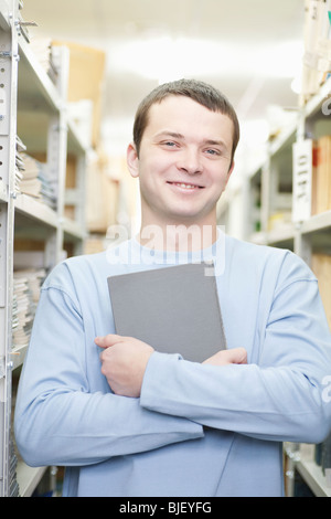 Portrait of man holding a book Stock Photo