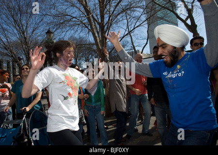 Bhangra dancers celebrate the Indian holiday of Holi at a street festival in New York Stock Photo