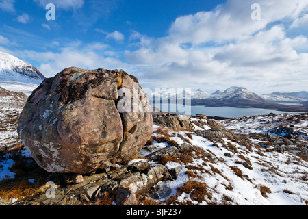 Erratic boulder on Bealach na Gaoithe near Torridon. View towards Beinn Damph. Wester Ross, Highland, Scotland, UK Stock Photo