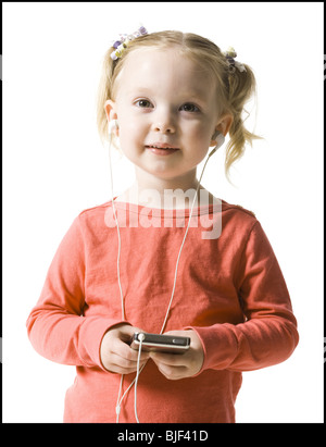 little girl listening to mp3 player Stock Photo