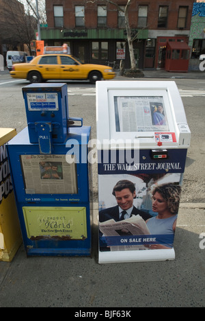 Wall Street Journal and New York Times newspaper distribution boxes in the New York neighborhood of Chelsea Stock Photo