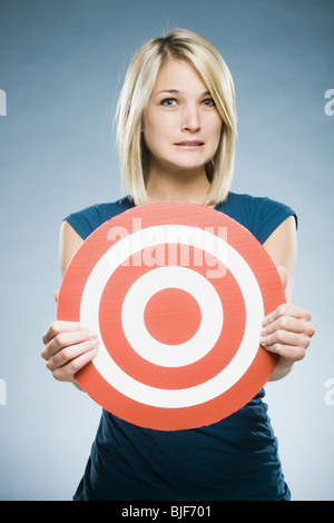 woman holding up a target Stock Photo