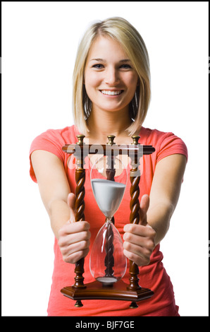 woman holding an hourglass Stock Photo