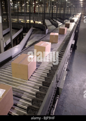 Boxes On Conveyor Belt In Warehouse, Philadelphia, Pennsylvania, USA Stock Photo