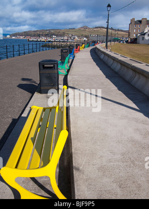 Brightly Painted Benches at the Seafront in Largs, Scotland Stock Photo