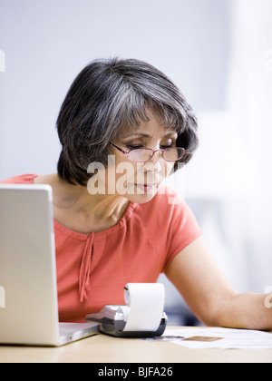 senior woman using a laptop computer Stock Photo