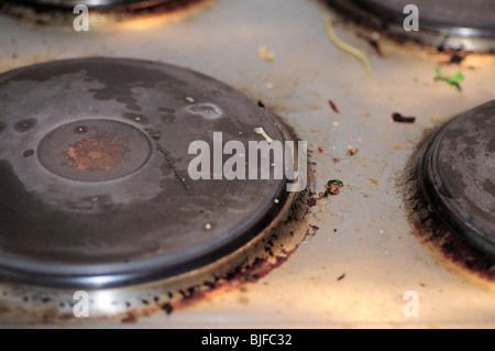 dirty electric cooker top Stock Photo