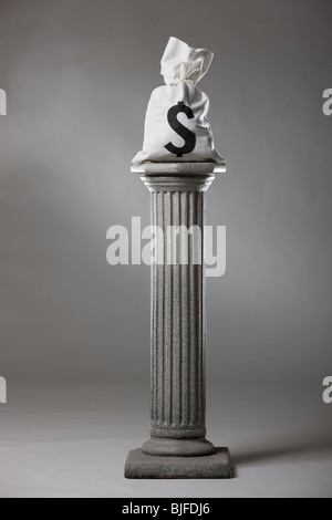 money on a pedestal Stock Photo