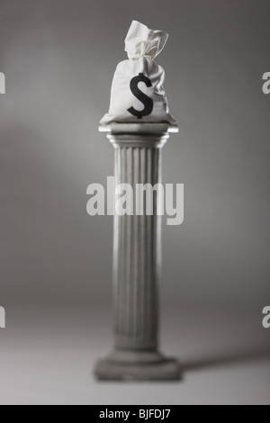 money on a pedestal Stock Photo