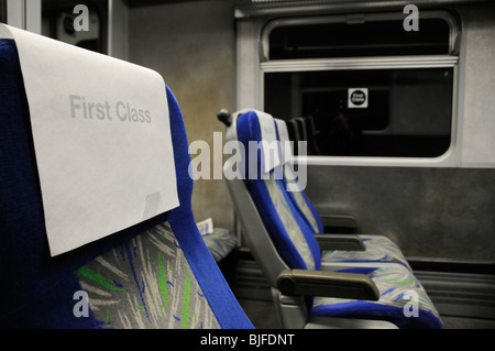 Empty first class head rest on train carriage seats at night Stock Photo