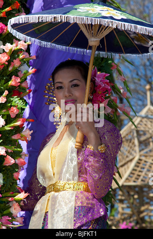 Flower display, Asian woman portrait floral art gaily decorated, bedecked, parade of show floats & colorful flowers; 34th Chiang Mai Festival,Thailand