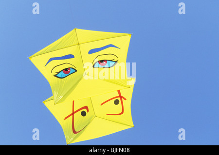 Colourful  kite flying high in sky Stock Photo