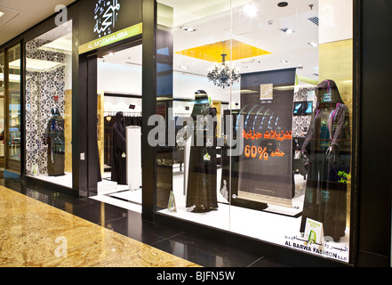 Shop selling traditional Muslim women's clothing, abayas, thoubs etc  in the Emirates Mall, Dubai, United Arab Emirates, UAE Stock Photo