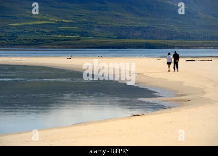 Couple walking in the morning by Flamingo lake near Hermanus, Western Cape, South Africa Stock Photo