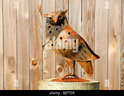 A yard sculpture of a horned Owl Stock Photo