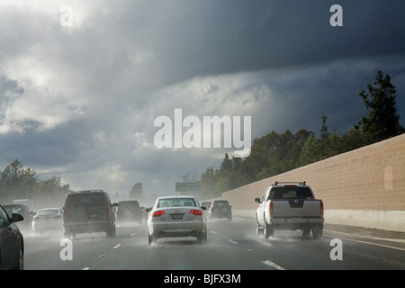 Cars driving in rainstorm on 101 Freeway. Los Angeles, California, USA Stock Photo