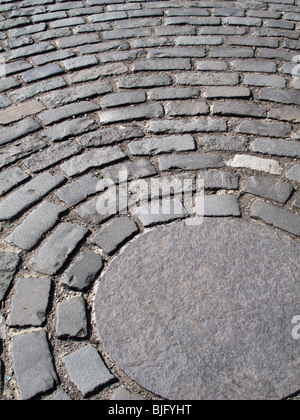 Granite setts in circular pattern Stock Photo