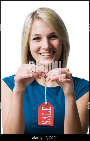 woman holding sale tag Stock Photo