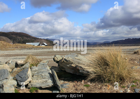 Barmouth Bridge and Mawddach estuary at low tide seen from the sand dune spit of Fairbourne, Gwynedd, north Wales, UK, Europe Stock Photo