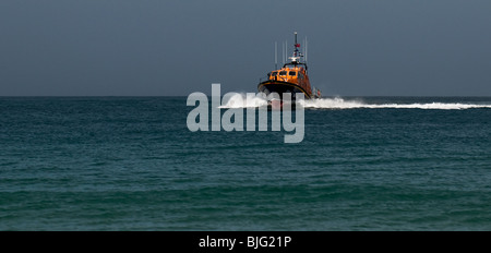 An RNLI lifeboat exercising off Sennen in Cornwall. Stock Photo