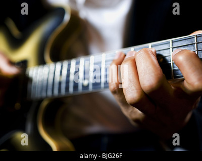 man playing a guitar Stock Photo