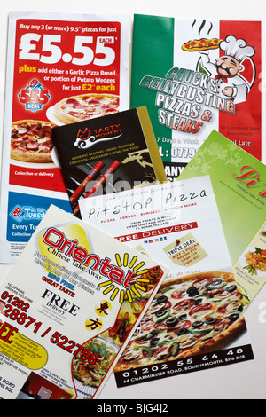 assortment of Junk mail unsolicited mail for fast food offers takeaways Stock Photo