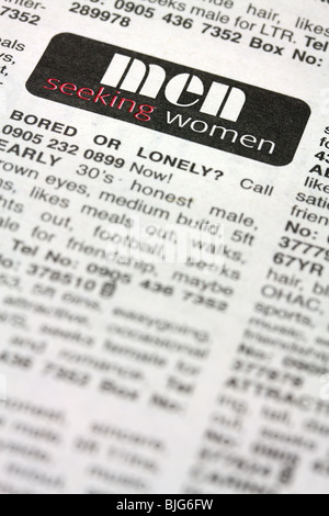 lonely hearts small ads section in newspaper Stock Photo