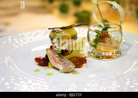 italian cuisine, fillet of fish served in a decorated dish for a gastronomic competition Stock Photo