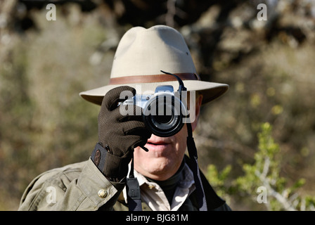 Man Using Point and Shoot Digital Camera at La Dormida Lodge in Cordoba, Argentina Stock Photo
