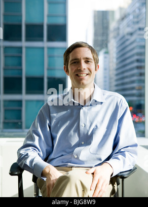man in a blue shirt at work Stock Photo