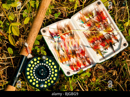 NEW BRUNSWICK, Fishing Rod & Reel and colorful box of Atlantic Salmon flys on the Famous Miramichi River Stock Photo