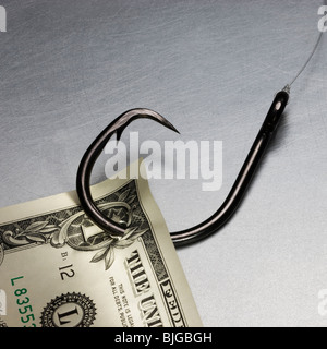 money on a fish hook Stock Photo