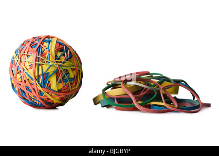 rubber band ball next to a pile of rubber bands Stock Photo