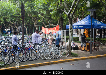 Bicycles for sale at start of semester on campus of Fudan University, Shanghai, China Stock Photo