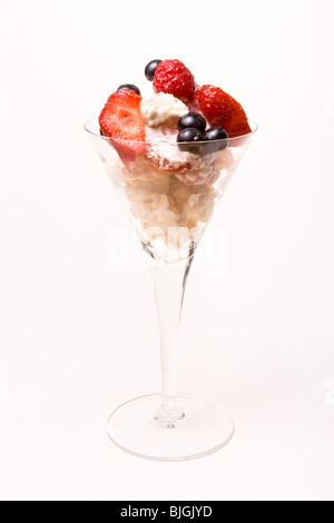 Eton Mess a traditional english summer dessert made from broken meringue, cream and summer fruits. Stock Photo