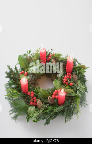 Advent wreath with four burning candles - Stock Photo