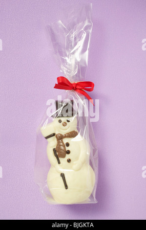 Chocolate snowman in cellophane bag - Stock Photo